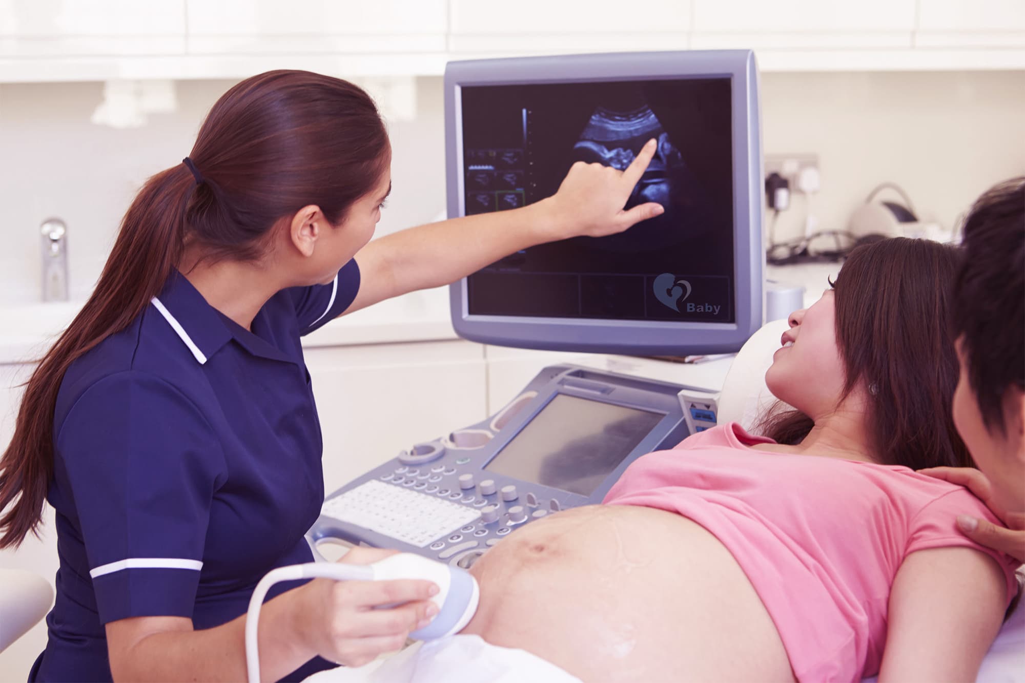 Lady having a baby scan with gel on her baby