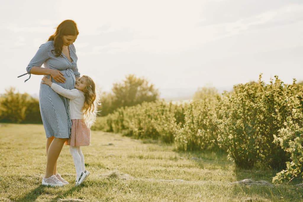 Pregnant mum and daughter - second pregnancy